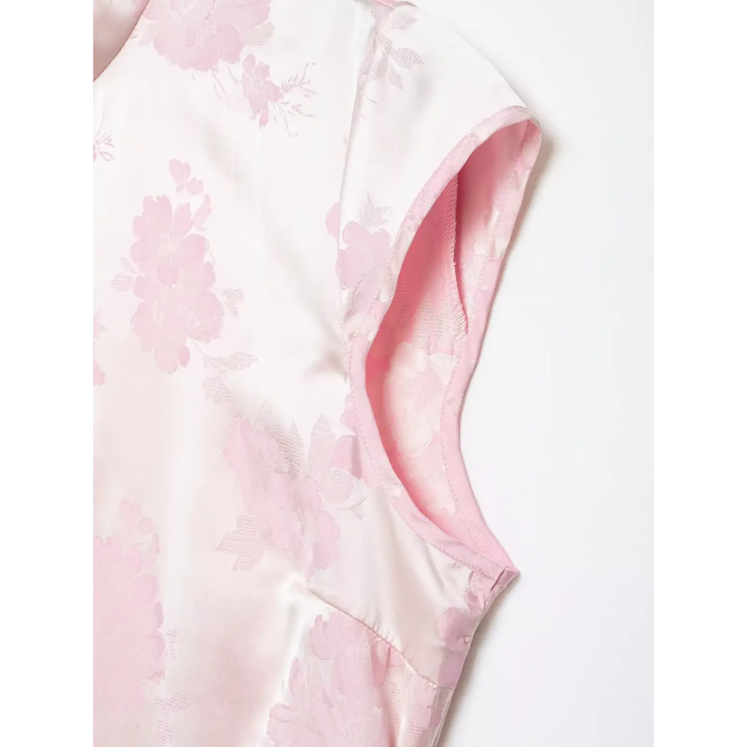 Armhole close-up, neat pink piping binding, cap sleeveless cut, inner lining construction