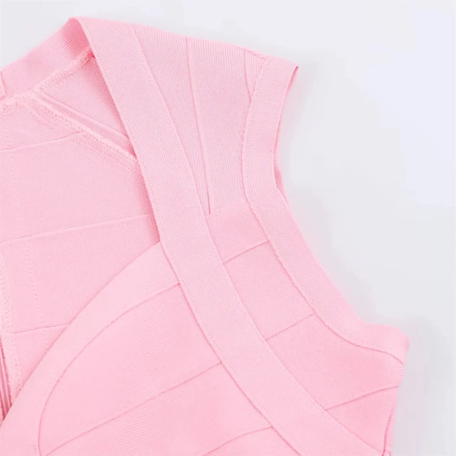 Shoulder & cap sleeve macro shot, diagonal bandage panel stitching, narrow armhole binding, ribbed stretch knit surface