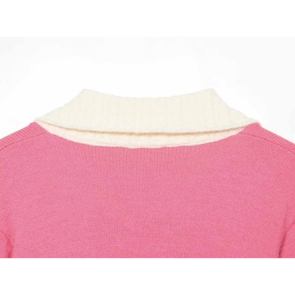 Back neck closeup, white cable textured collar on pink knit sweater