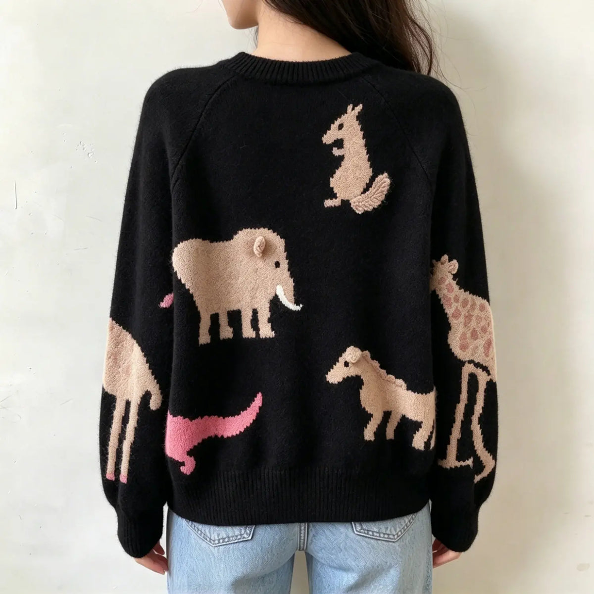 Model wearing cartoon animal intarsia knit cardigan back