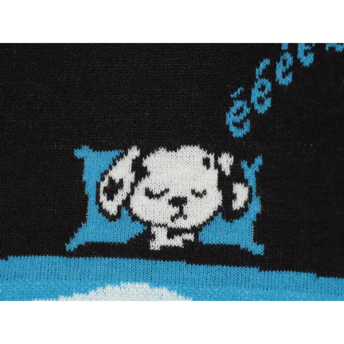 Close-up of sleeping cartoon dog intarsia knit