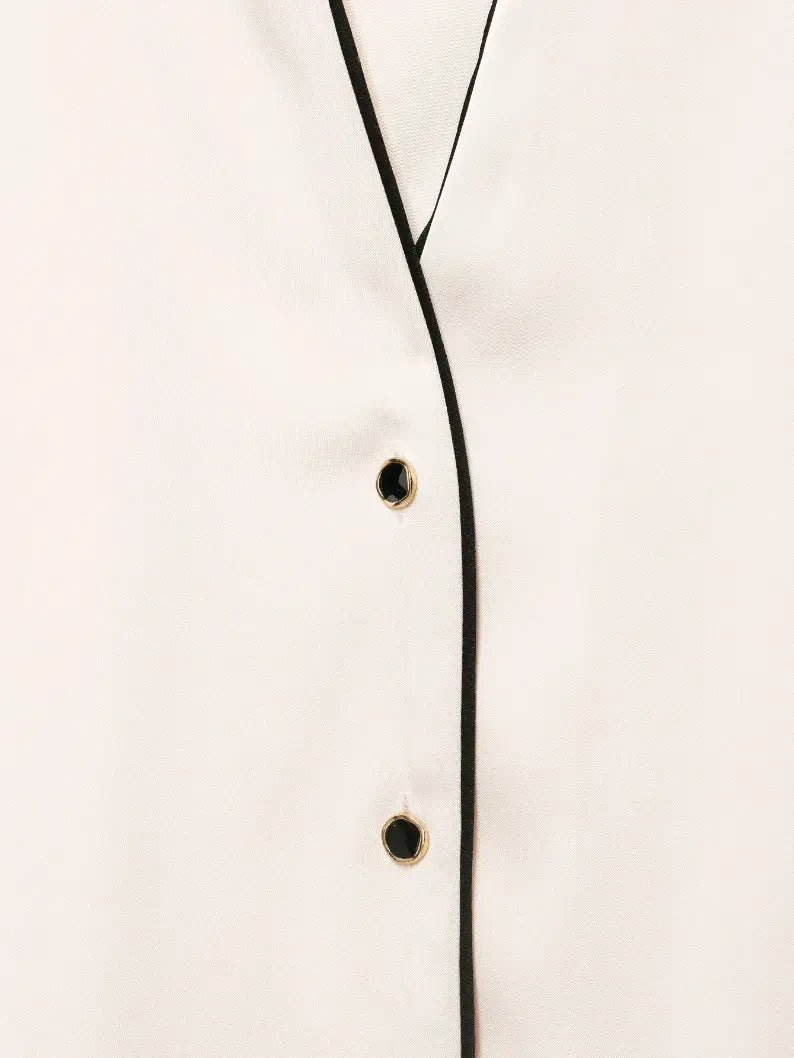 Macro close-up of black and gold rim buttons