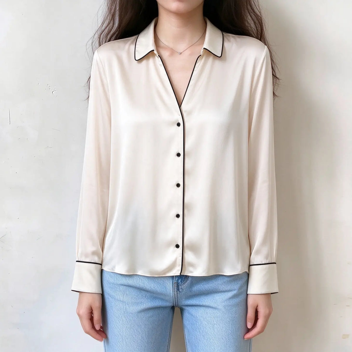 Model wearing champagne contrast piping satin button front shirt with jeans, front view
