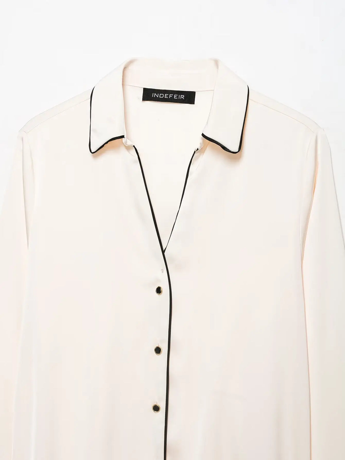 Close-up of collar and V-neck button placket