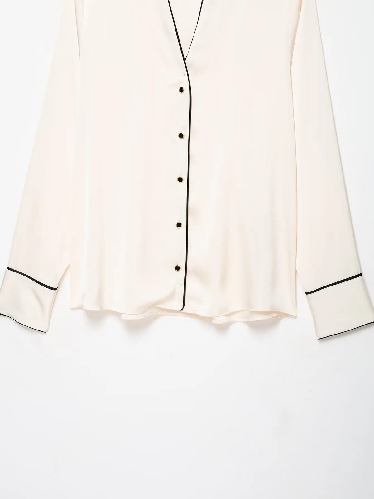 Close-up of button placket and cuffs