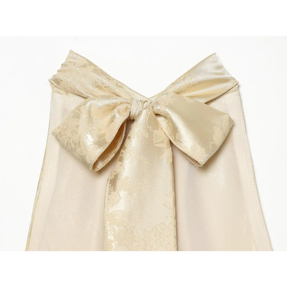 Close-up of self fabric bow tie at back neckline