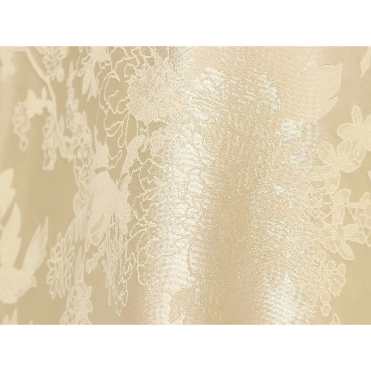 Close-up of floral jacquard weave on champagne satin fabric