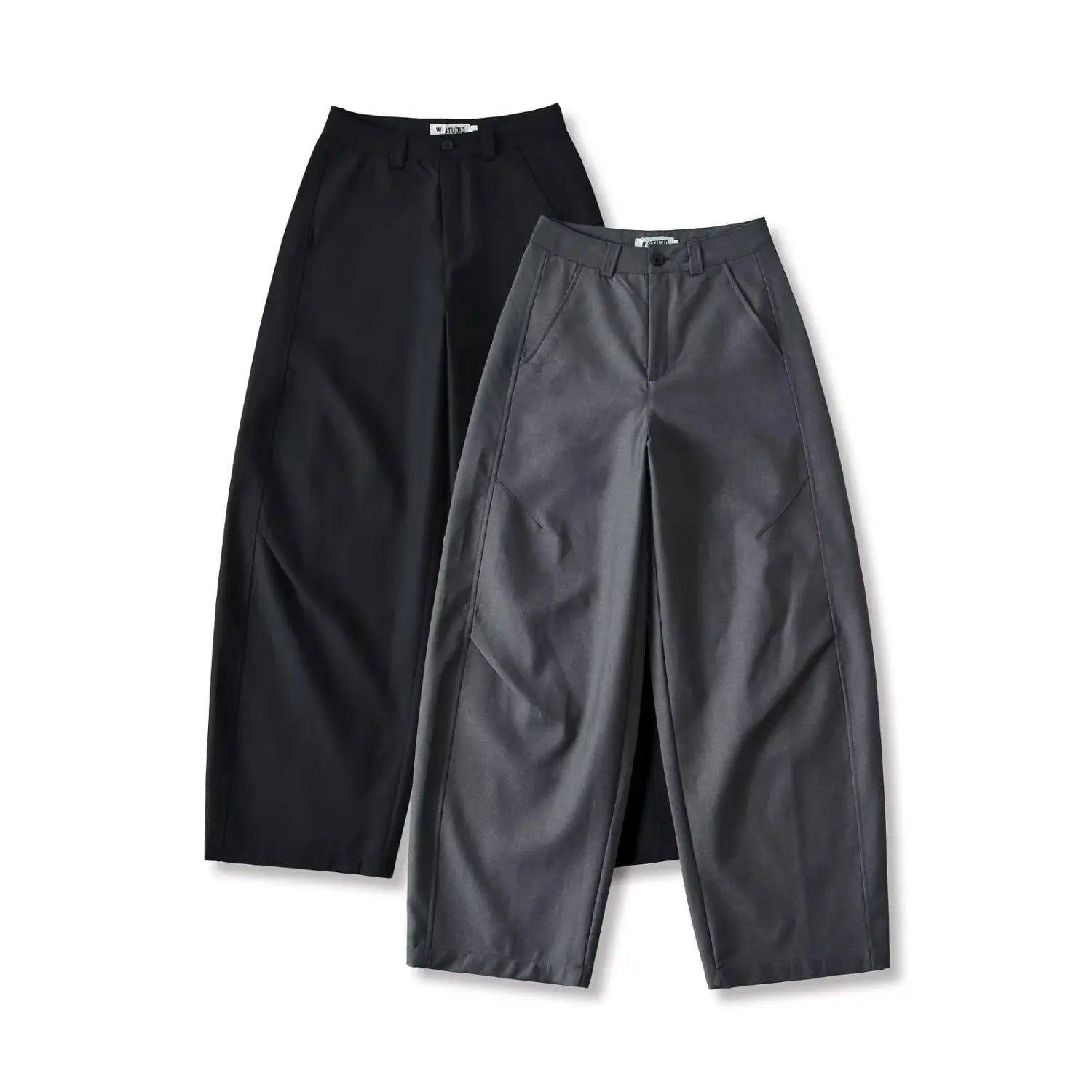 Studio flat lay of women pleated wide leg trousers, charcoal gray front placed in front of black pair