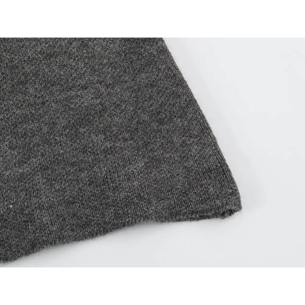 Close-up of raw hem edge and knit texture