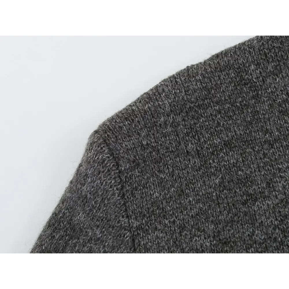 Close-up of fuzzy charcoal marled knit fabric