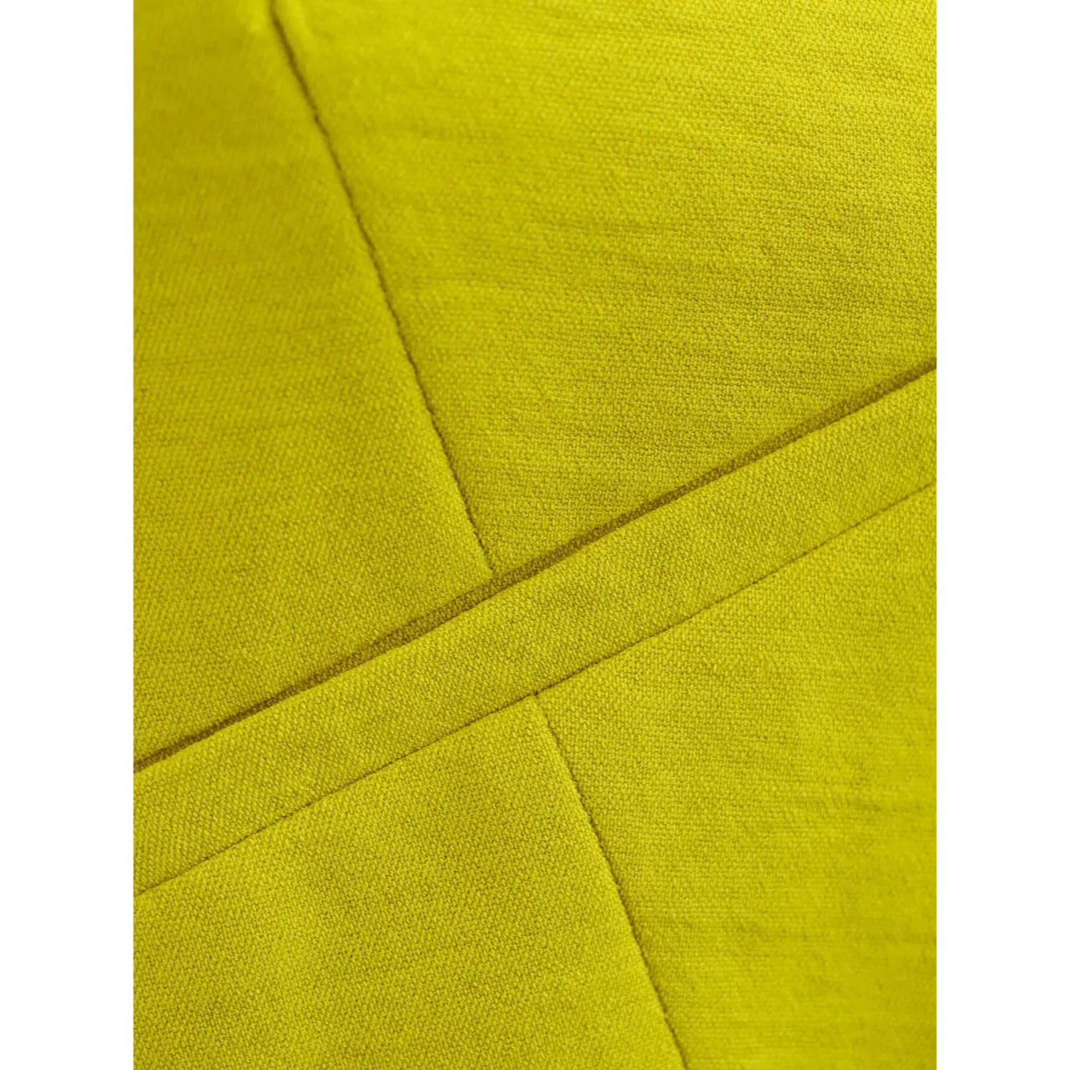 Close-up of tailored pocket seam construction on chartreuse asymmetric cropped waistcoat