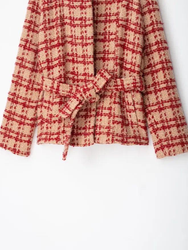 Close-up of self-tie belt knot and cropped hem
