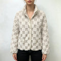 Female model wearing beige white checkered fuzzy faux fur jacket, front full view, casual winter outfit