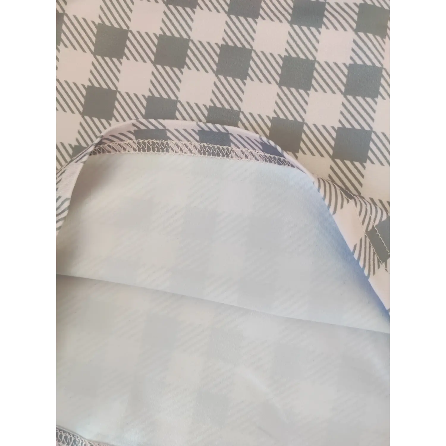 Hem and lining closeup of checkered slim fit mini dress