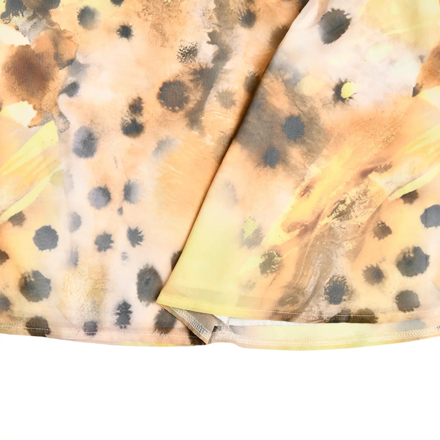 Fabric and stitching closeup, vintage watercolor leopard slip dress hem detail