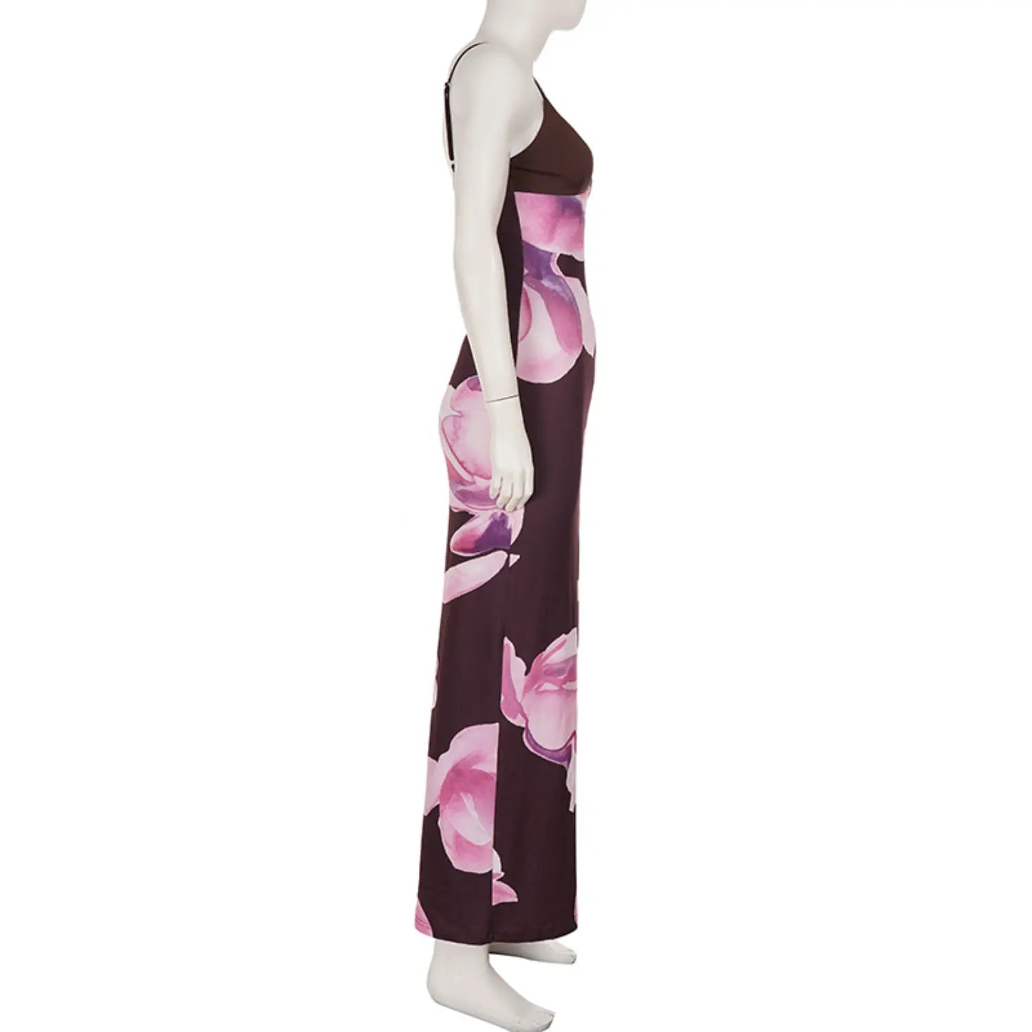 Side profile full studio shot on white mannequin of figure-hugging floor-length slip dress, thin rear adjustable spaghetti straps, oversized soft watercolor pink magnolia floral print on stretch knit fabric