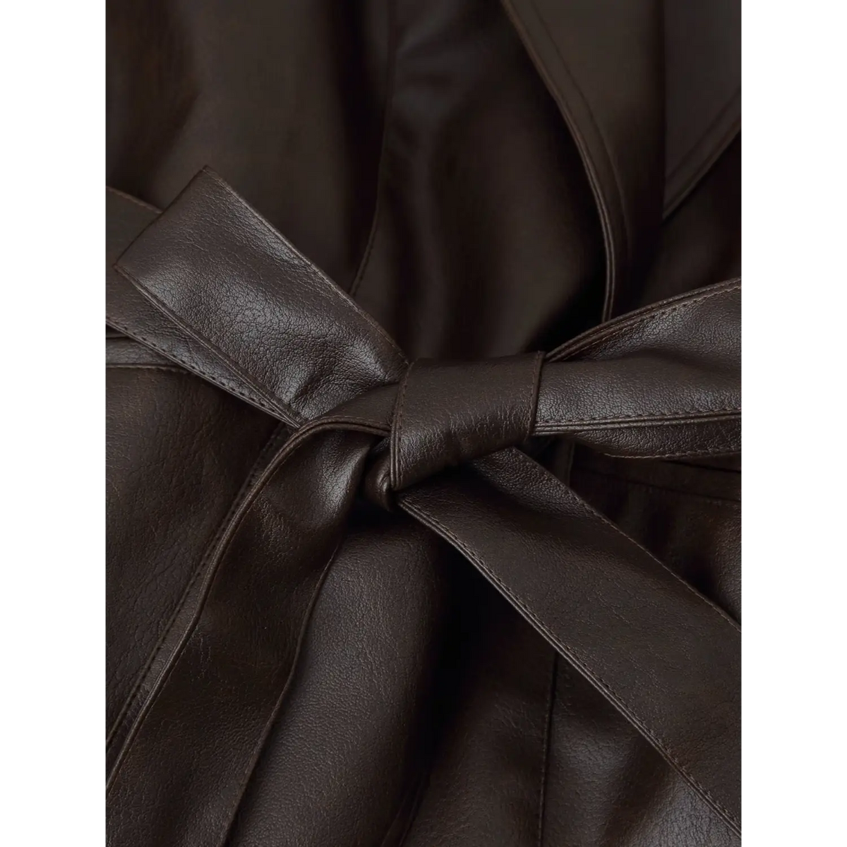 Close-up of knotted PU self-tie belt