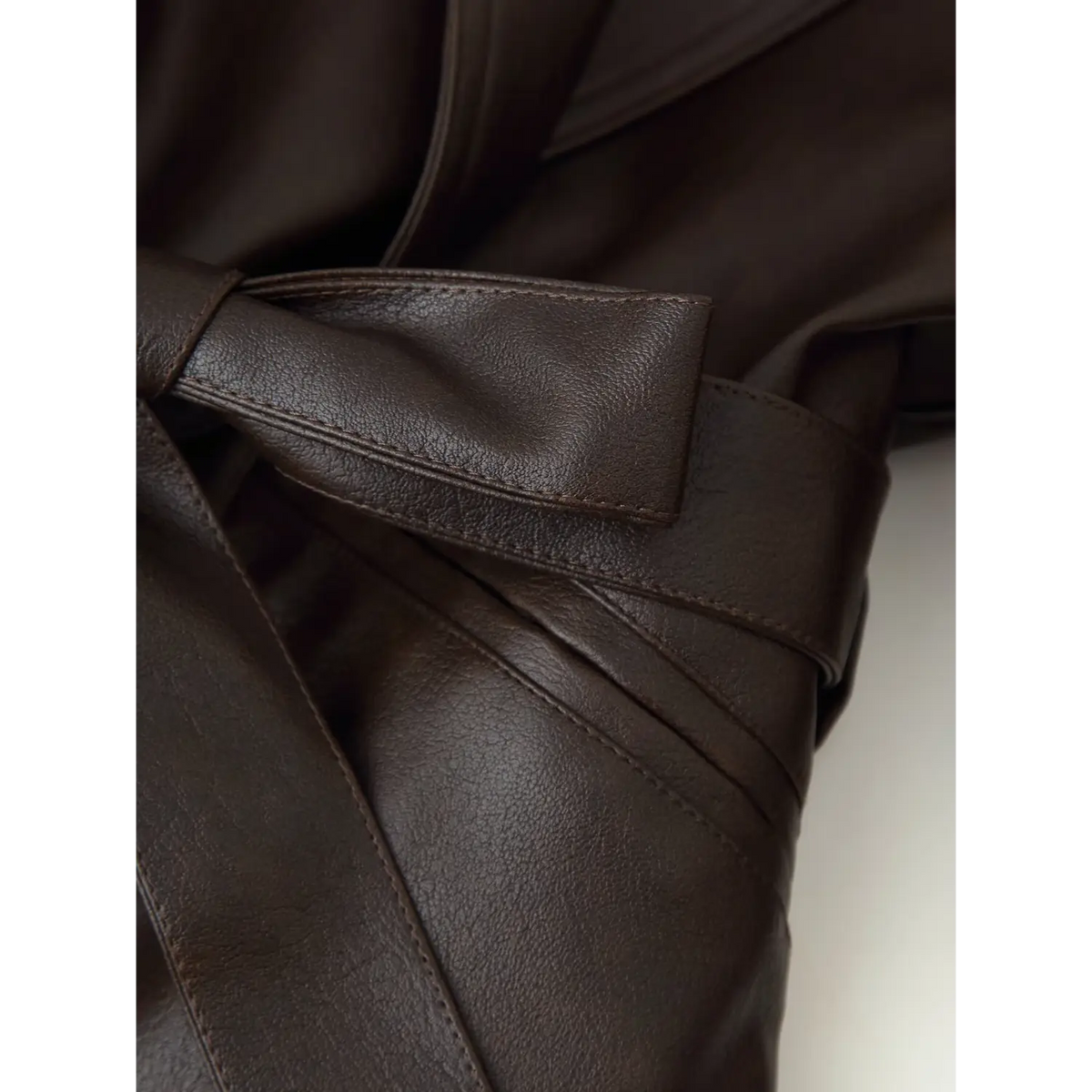 Close-up of PU belt stitching and edge