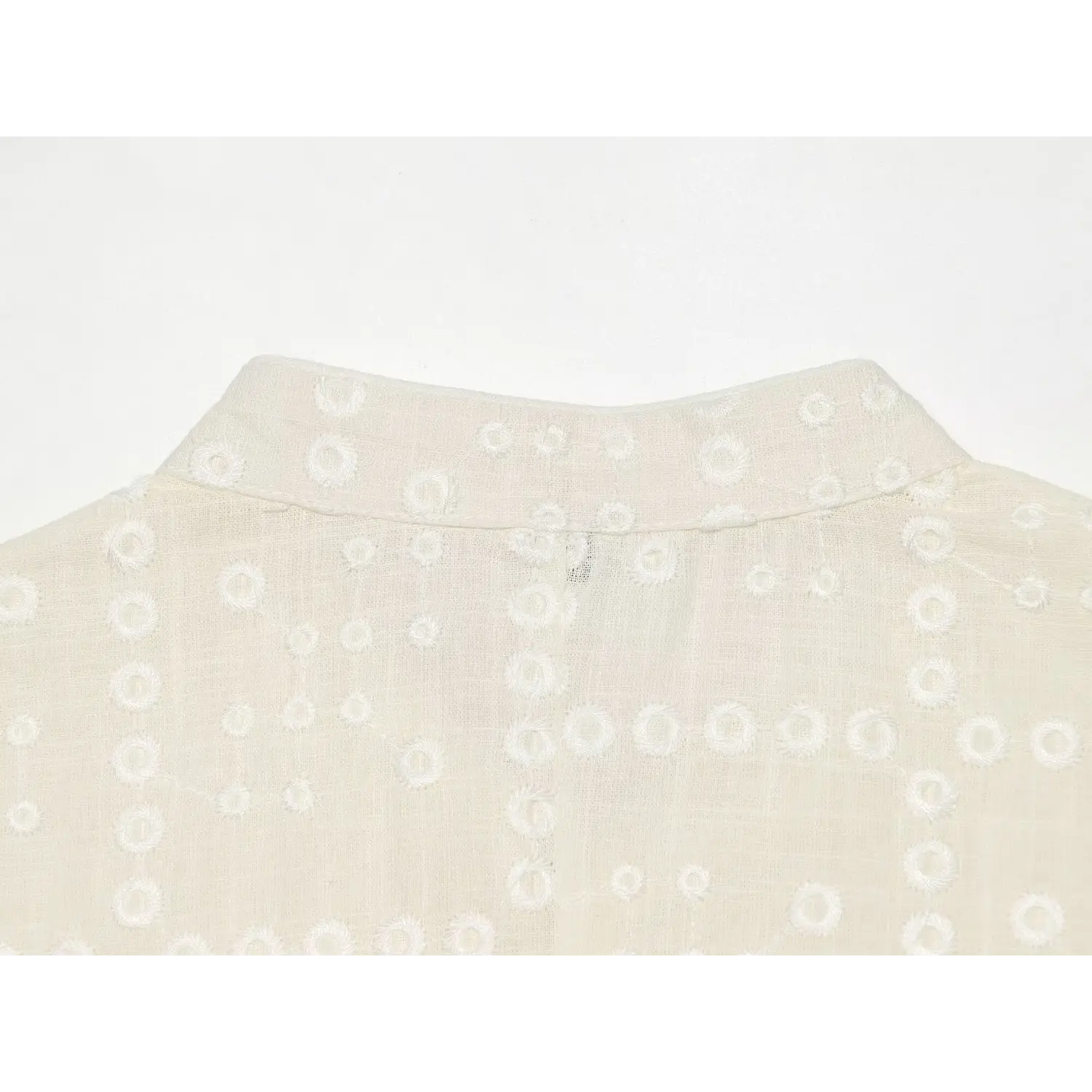 Circle hollow embroidery fabric wrinkle macro shot, 3D circular cutout breathable sheer lightweight textured linen soft drape fabric shot