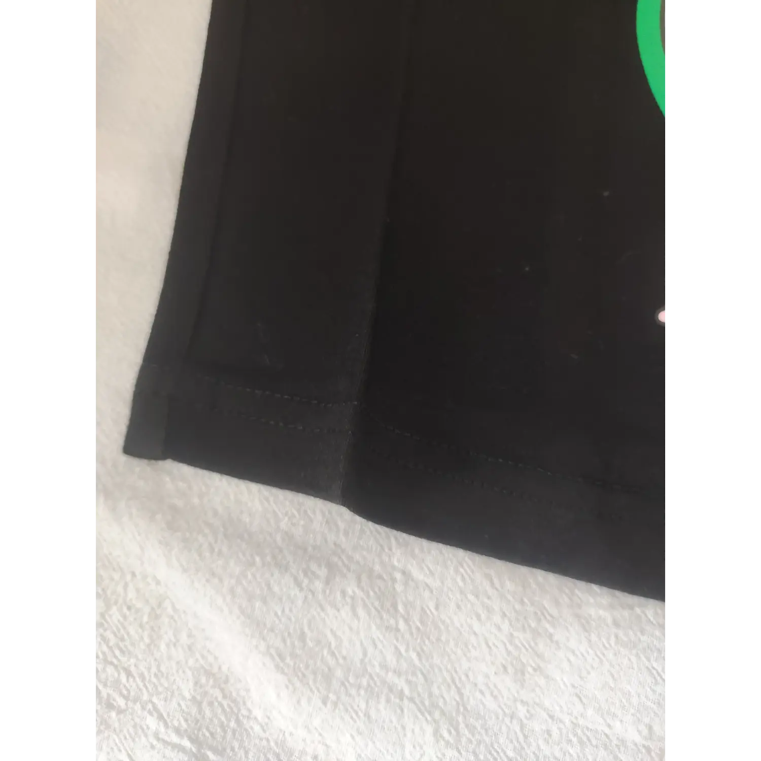 Macro shot neat stitching hem detail black stretch crop camisole tank top