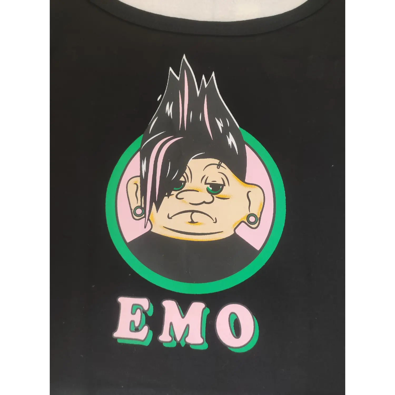 Close-up detail cartoon troll character graphic print on black sleeveless cami top