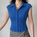 Model front view wearing cobalt blue eyelet sleeveless collared shirt, casual fitted outfit