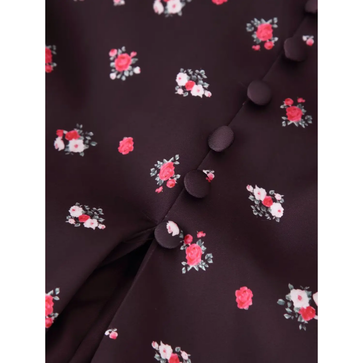 Close‑up stitching and covered button details on coffee ditsy floral maxi dress