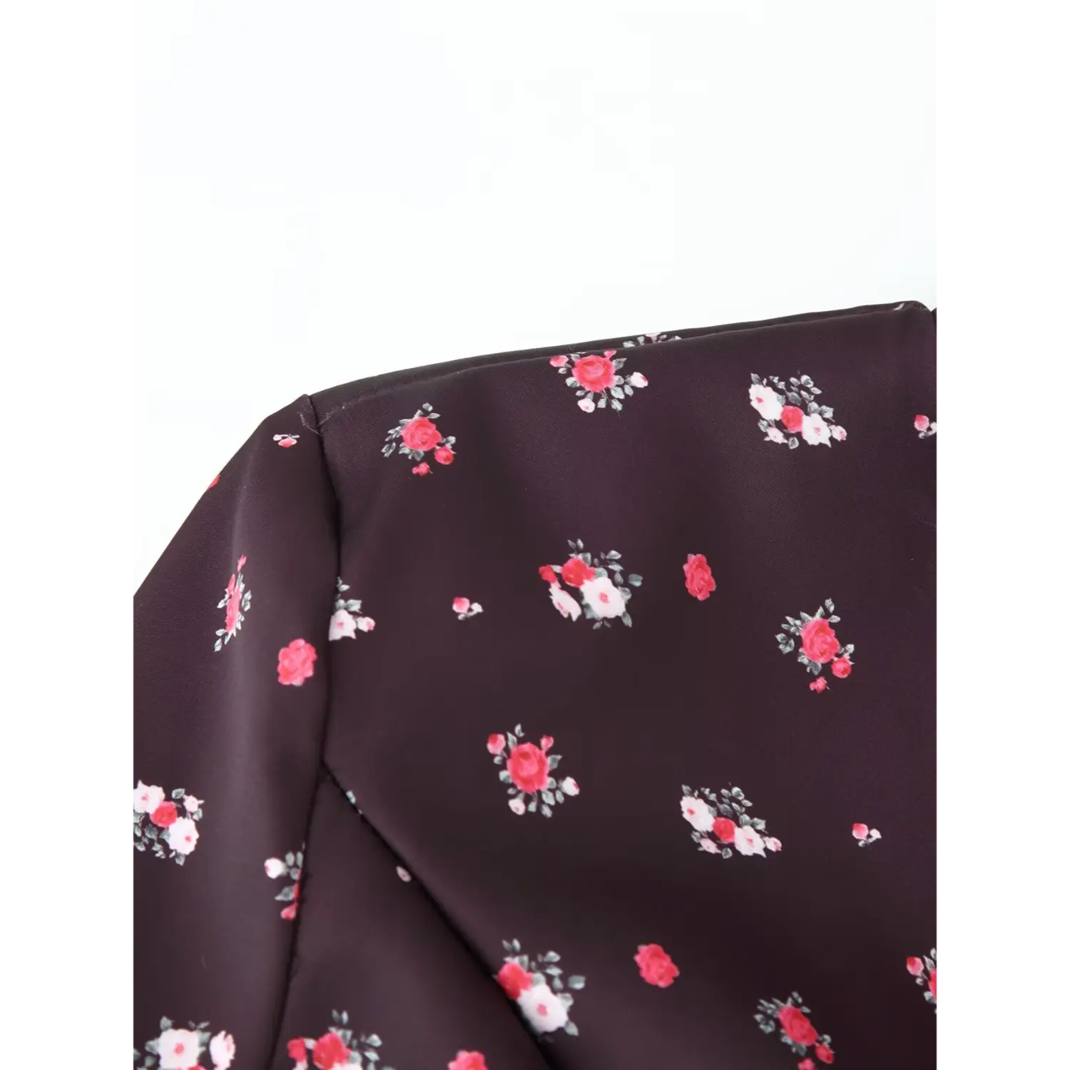 Close‑up shoulder seam and fabric texture of coffee ditsy rose floral maxi dress