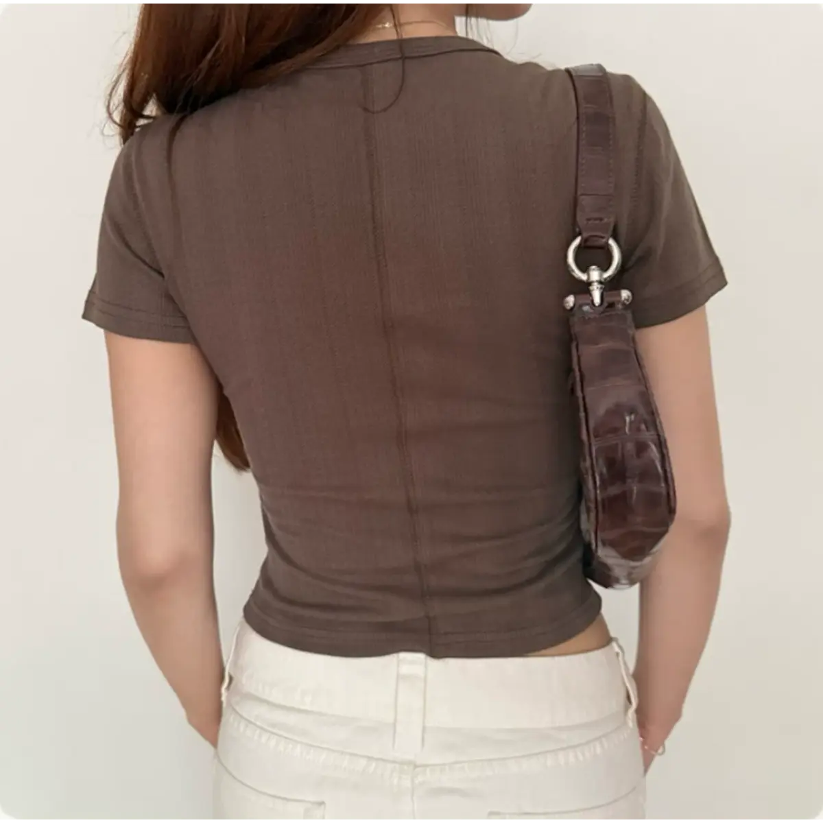 Close up full back center seam detail coffee hollow cable rib knit slim cropped short sleeve top