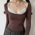 Coffee lace fake two piece u neck long sleeve top half body indoor shot, light blue inner lace thin strap contrast design, stretch knit slim cropped fit vintage slim commuter base top