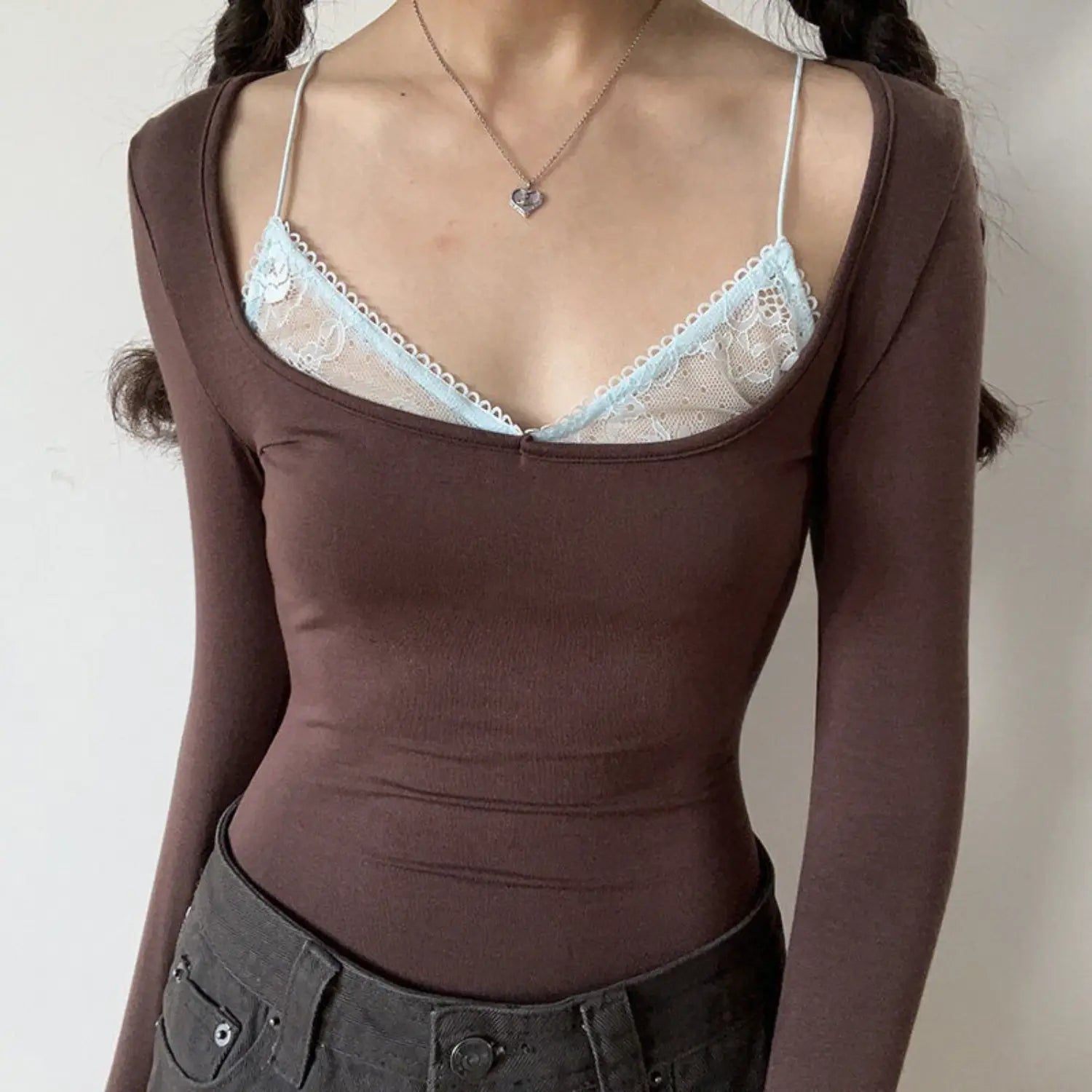 Coffee lace fake two piece u neck long sleeve top half body indoor shot, light blue inner lace thin strap contrast design, stretch knit slim cropped fit vintage slim commuter base top