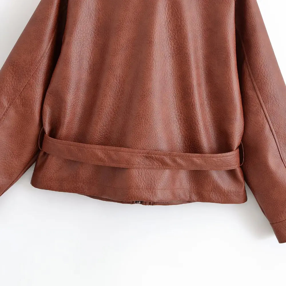 Close-up of back waist belt and leather hem