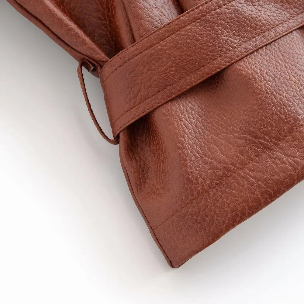 Close-up of belt loop and leather hem