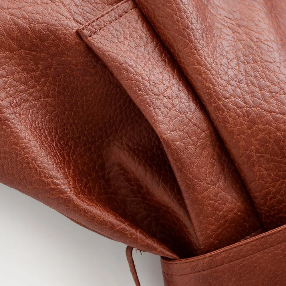 Close-up of welt pocket and leather texture