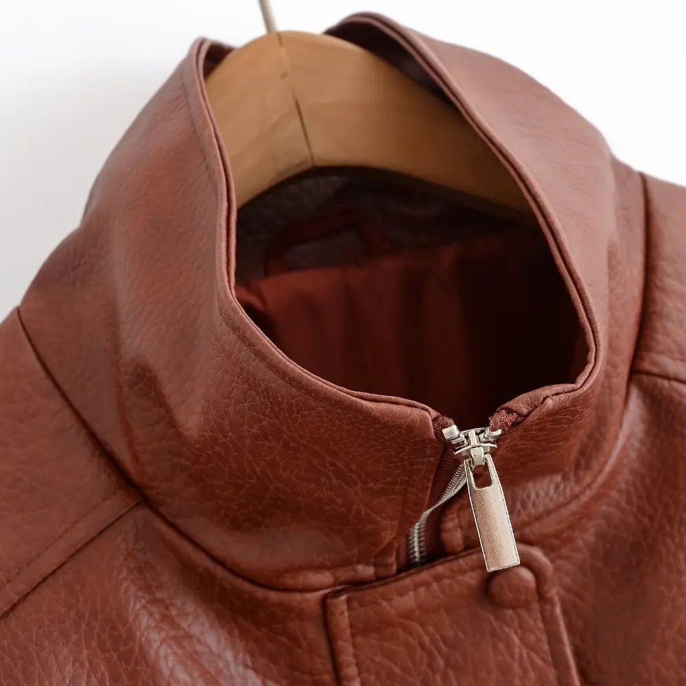 Close-up of stand collar lining and metal zipper pull