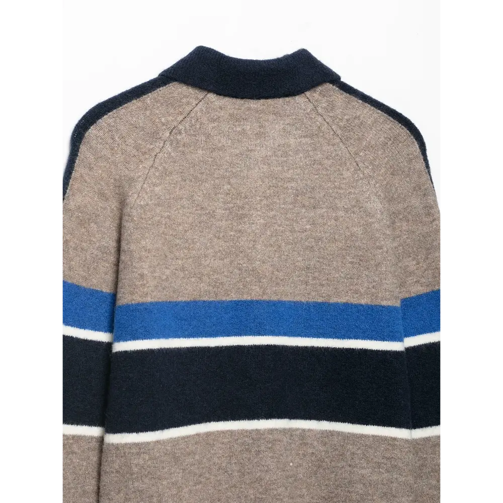 Close-up of back polo collar and stripe detail