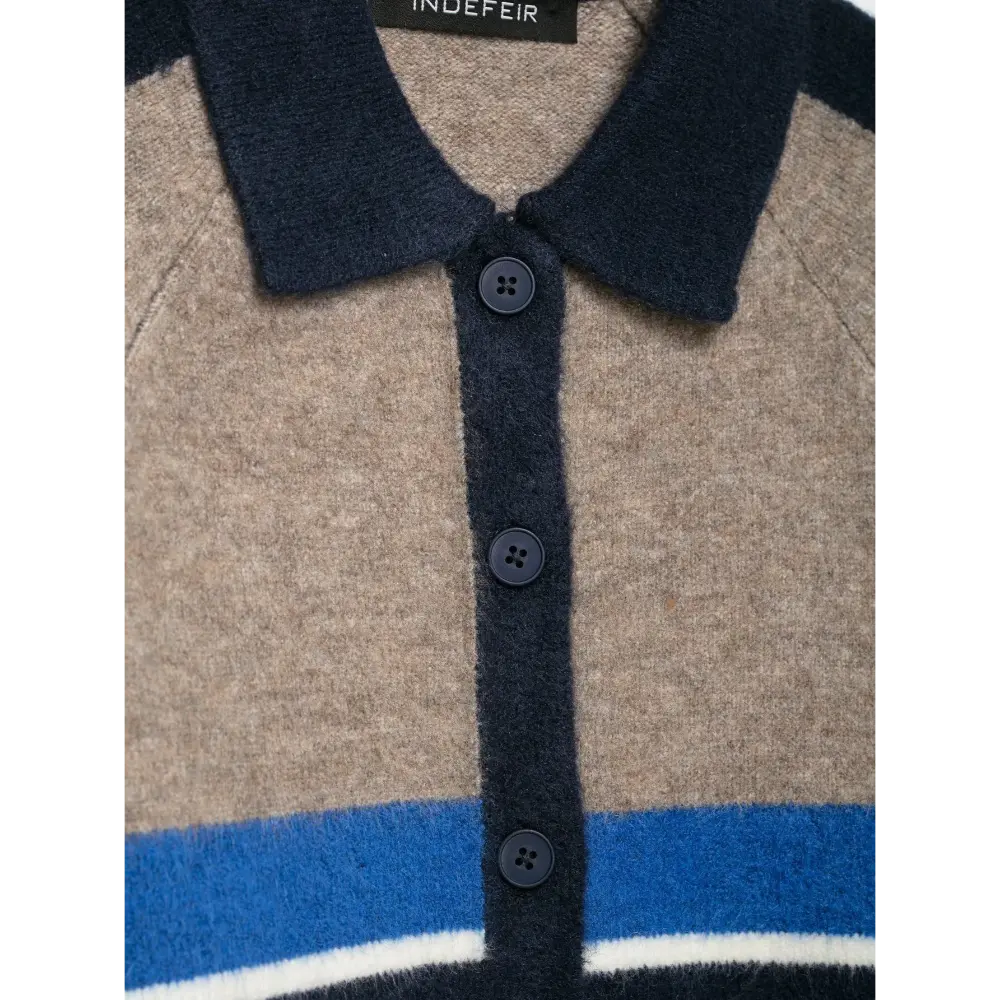 Close-up of navy round buttons on placket