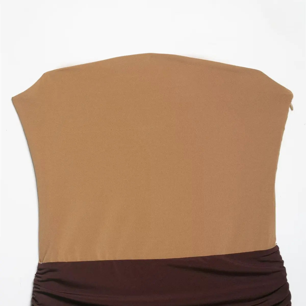  Front view of the colorblock tube dress, showing the tan bodice, ruched dark brown waistband, and polka dot skirt
