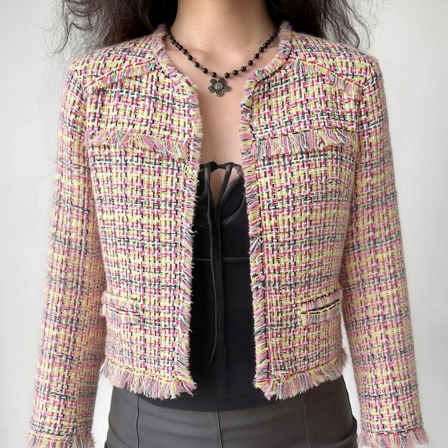 Female model wearing pink yellow multicolor frayed tweed cropped jacket