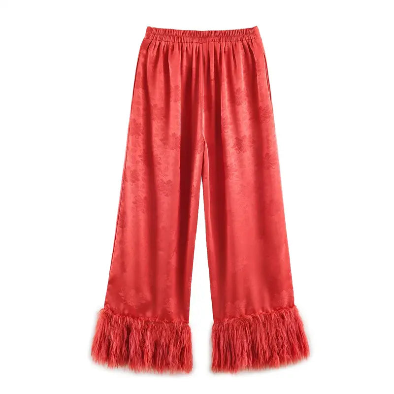 Back flat lay coral red jacquard loose wide leg pants, full elastic smocked waist, matching peony jacquard lining, long fringe tassel ankle cuffs