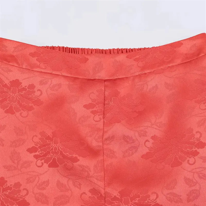 Front V shaped waistband closeup, embossed peony jacquard satin texture, neat front center seam stitching