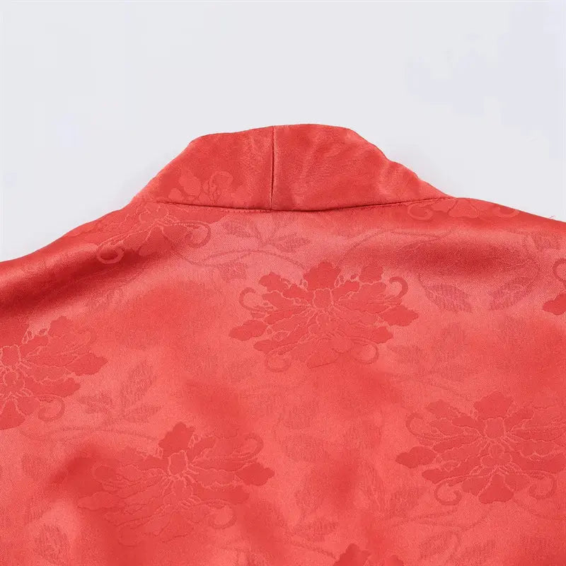 Upper back mandarin stand collar macro shot, allover subtle peony embossed jacquard satin texture