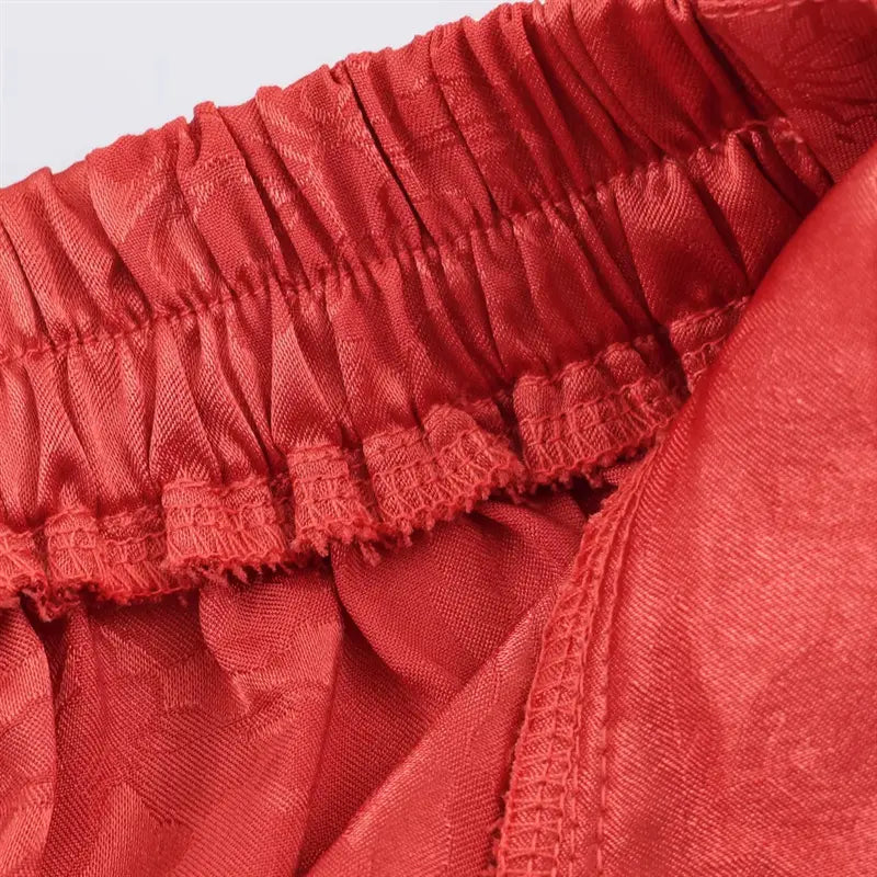 Side straight leg vertical seam closeup, relaxed wide leg silhouette, smooth jacquard material