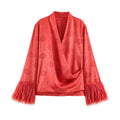 Front flat lay coral red loose outer jacket, embossed peony jacquard satin, cross wrap surplice V neck, long sleeves with fluffy tassel fringe cuffs, relaxed oversized fit lightweight layering coat