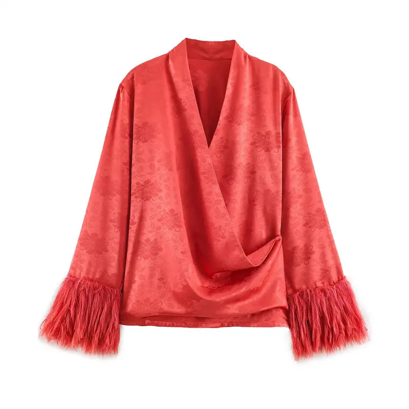 Front flat lay coral red loose outer jacket, embossed peony jacquard satin, cross wrap surplice V neck, long sleeves with fluffy tassel fringe cuffs, relaxed oversized fit lightweight layering coat