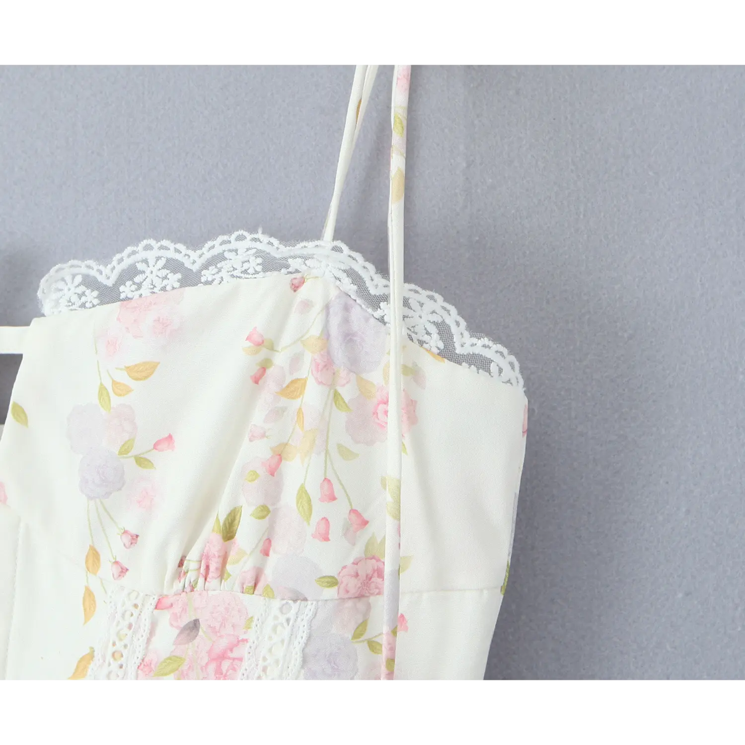 Close‑up shot, floral printed bodice with lace inset and scalloped lace trim