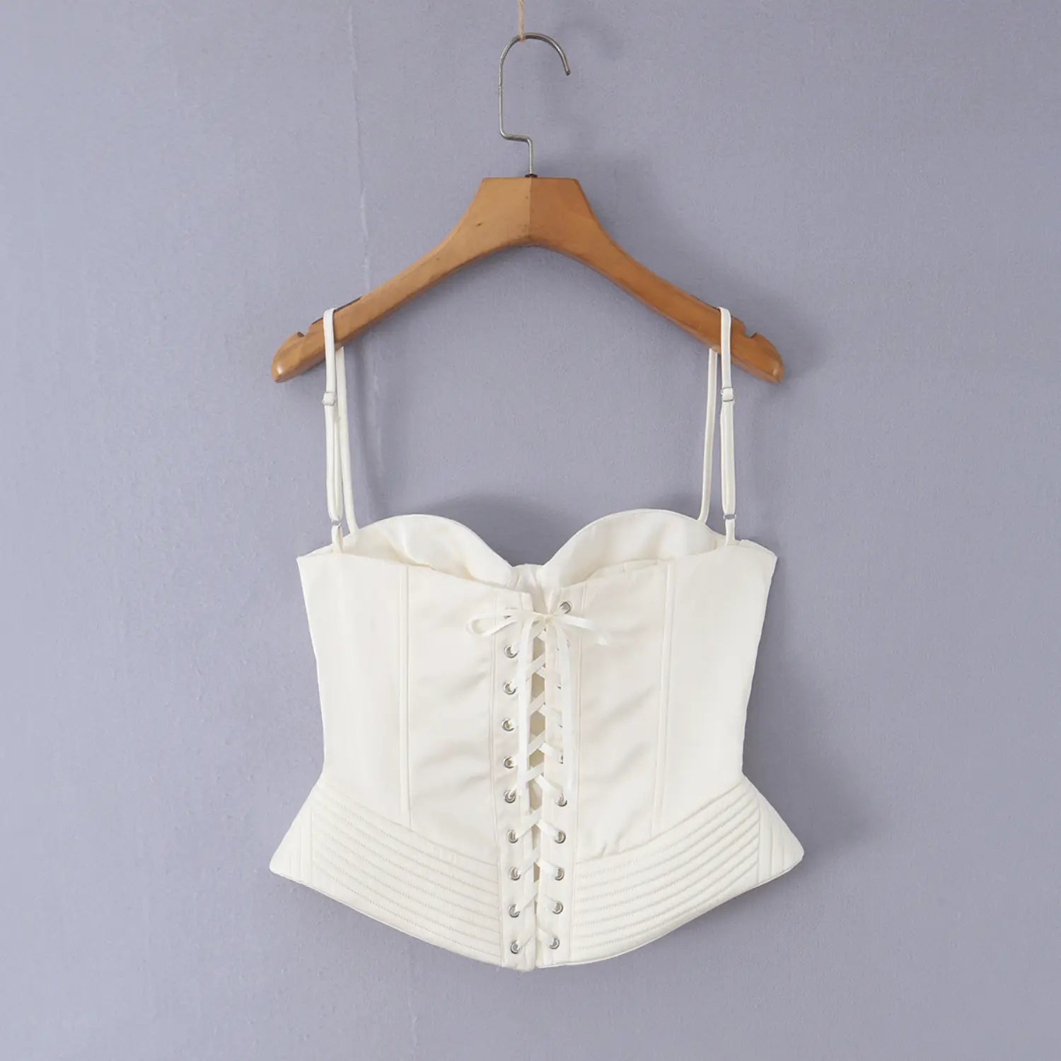 Back view white corset camisole top, ribbon lace-up eyelet closure, adjustable thin spaghetti straps, fitted waistline