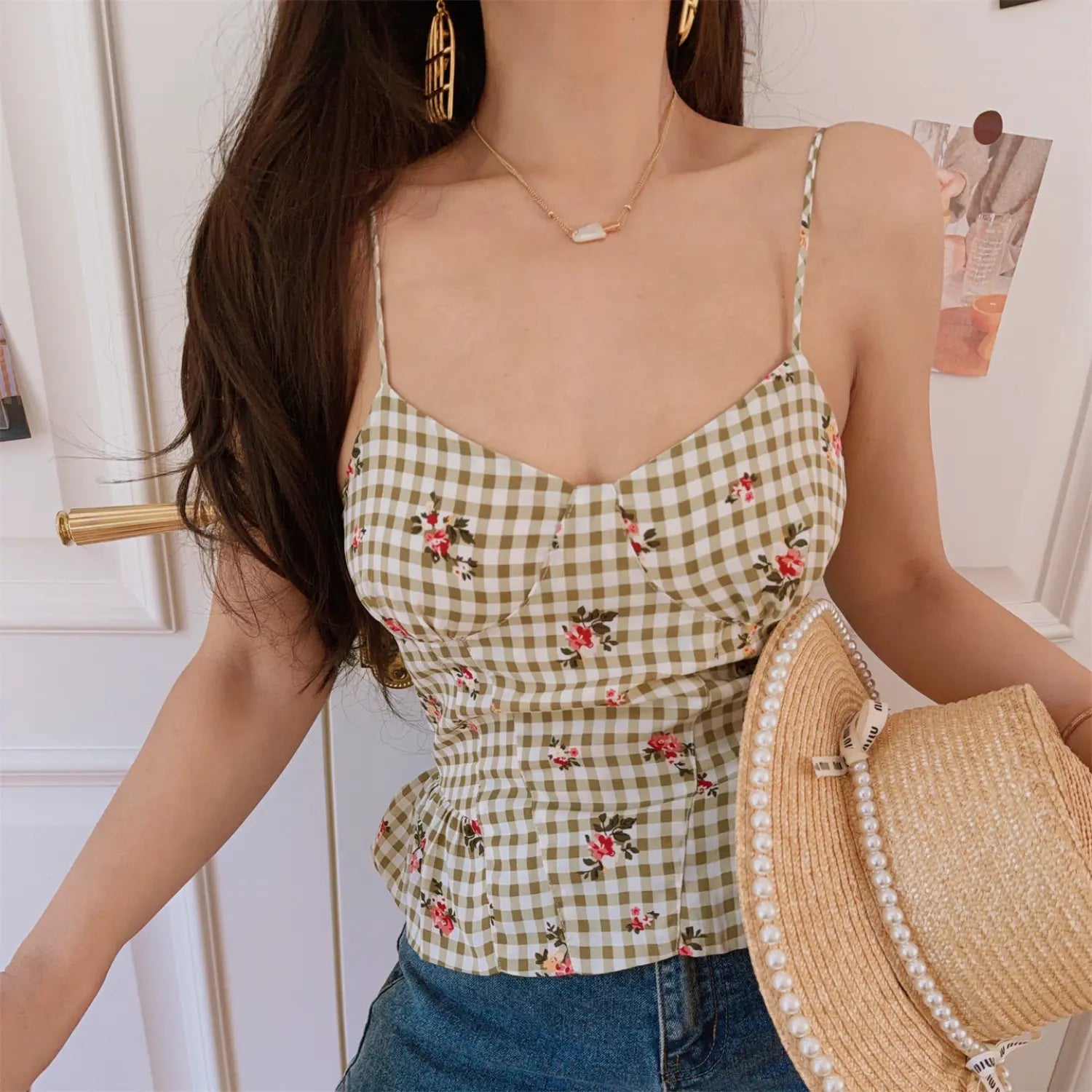 Cottagecore style olive check floral peplum cami top, model holding pearl trimmed straw hat, sweet vintage daily outfit