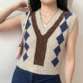 Model wearing cream fuzzy argyle knit sweater vest with jeans, casual daily outfit