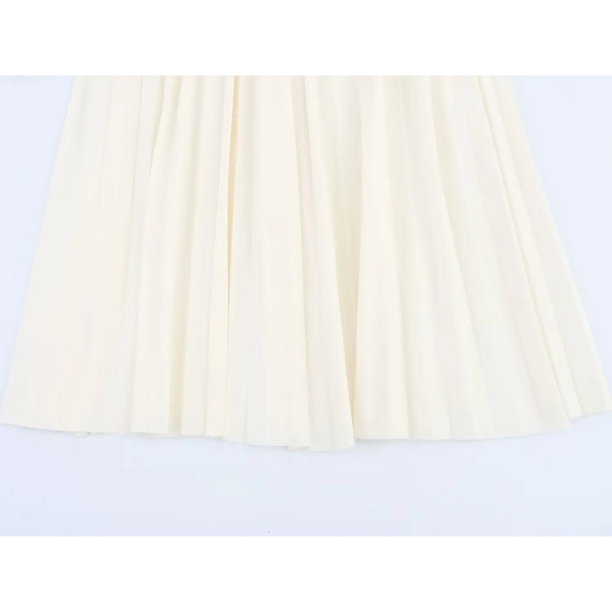 Close-up of pleated skirt hem
